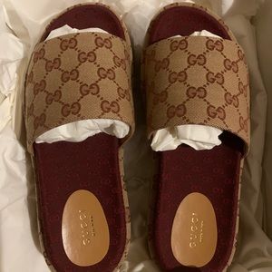Brand new gucci slides still in the box.